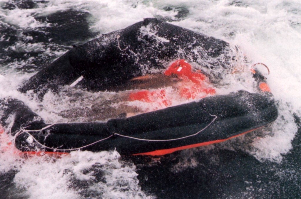An Estonia liferaft washed by rough waves, in an archive photograph from Finnish accident-investigation material.