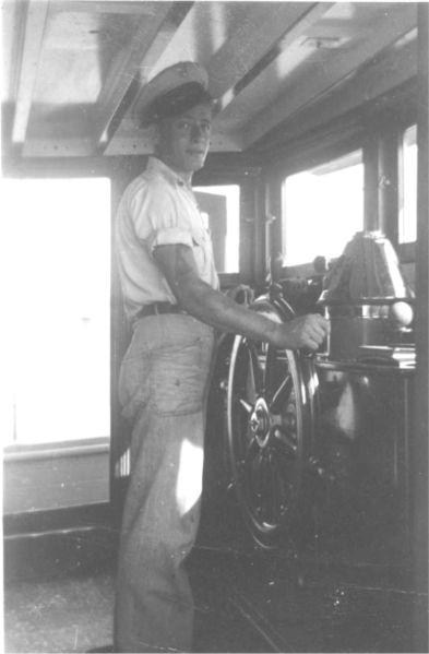 Chief Body at Joyita’s wheel during US Navy service, circa 1942.