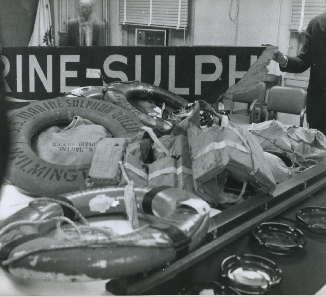 Recovered life rings, life jackets and name boards from Marine Sulphur Queen in a U.S. Coast Guard archive photograph.